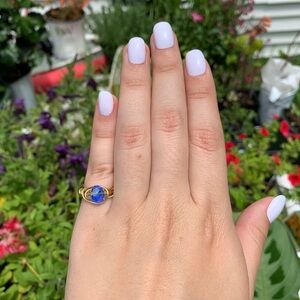 NWOT blue crystal bead gold wire ring.
